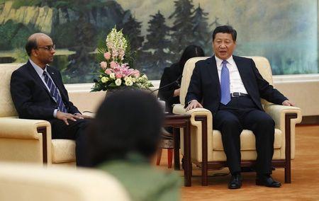 China&#39;s President Xi Jinping meets with the guests at the Asian Infrastructure Investment Bank launch ceremony at the Great Hall of the People in Beijing